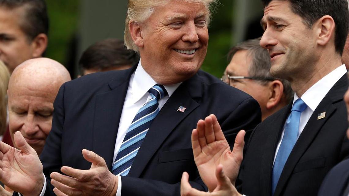 President Donald Trump talks to House Speaker Paul Ryan Thursday in the Rose Garden of the White House after the House pushed through a healthcare bill.