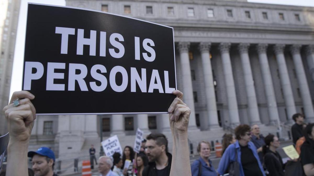 A demonstrator holds up a sign during a protest against abortion bans on May 21 in New York City.