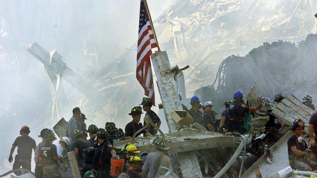 The U.S. flag flies over the World Trade Center rubble in New York on Sept. 13, 2001.