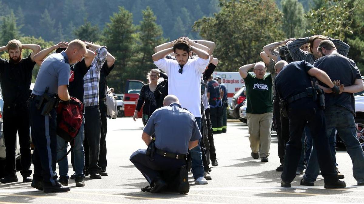 
Police search students outside Umpqua Community College in Roseburg, Ore.
