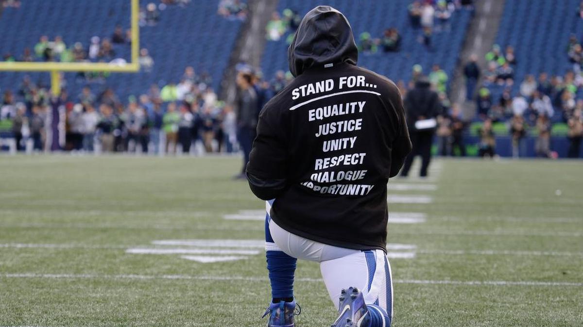 A Colt player wears a T-shirt in reference to protests during the national anthem.