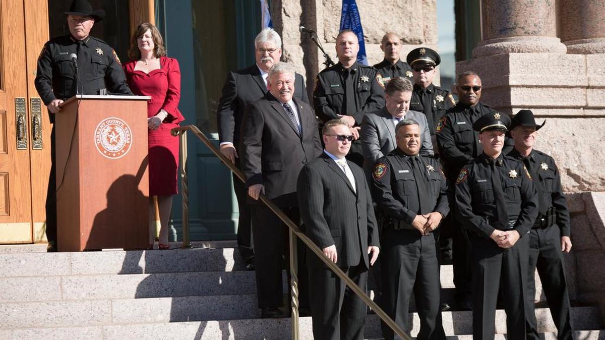 Sheriff Bill Waybourn, with his wife Laura, introduces his leadership team Sunday at the Tarrant County Courthouse in Fort Worth.