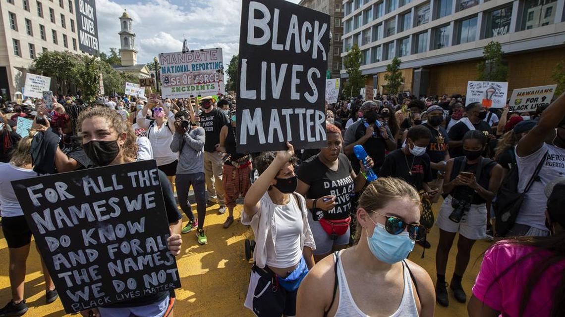 FILE - In this Aug. 28, 2020, file photo, marchers chant as they gather at Black Lives Matter Plaza near the White House in Washington, during the March on Washington commemorating the 57th anniversary of the Rev. Martin Luther King Jr.’s “I Have A Dream” speech. In the nation’s capital on Saturday, Aug. 28, 2021, multiracial coalitions of civil, human and labor rights leaders are convening rallies and marches to urge passage of federal voter protections that have been eroded since the Voting Rights Act of 1965. (AP Photo/Manuel Balce Ceneta, File)