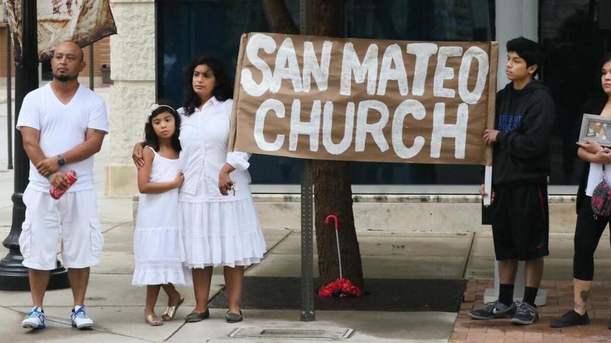 San Mateo Mission parishioners protest on Sept. 10 outside St. Patrick’s Cathedral in Fort Worth. The mission will close in November.