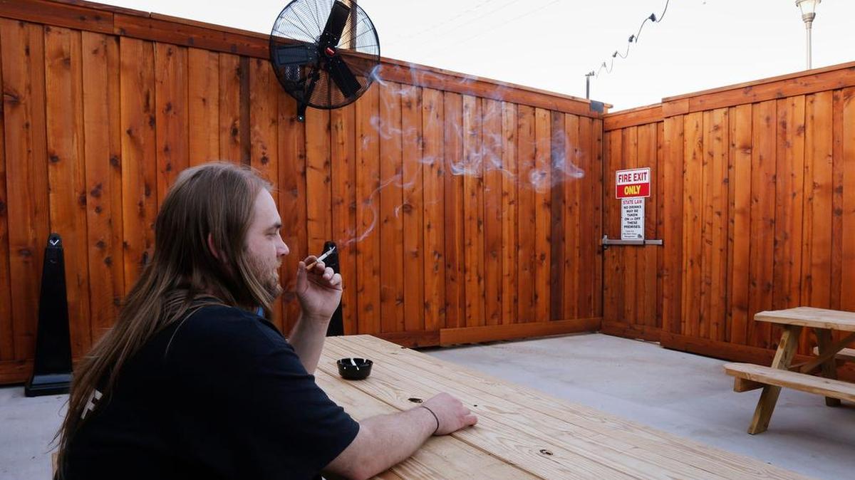 Employee Jimmy Kirk takes a break Billy Bob's Texas smoking patio. The club will prohibit smoking in May, Wednesday, April 27, 2016.