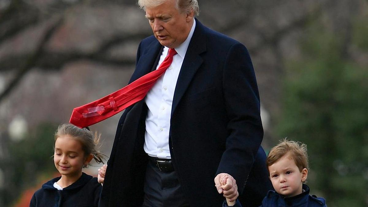 President Donald Trump walks to Marine One on the South Lawn of the White House with his grandchildren Joseph and Arabella Kushner, before departing for Florida on Friday.
