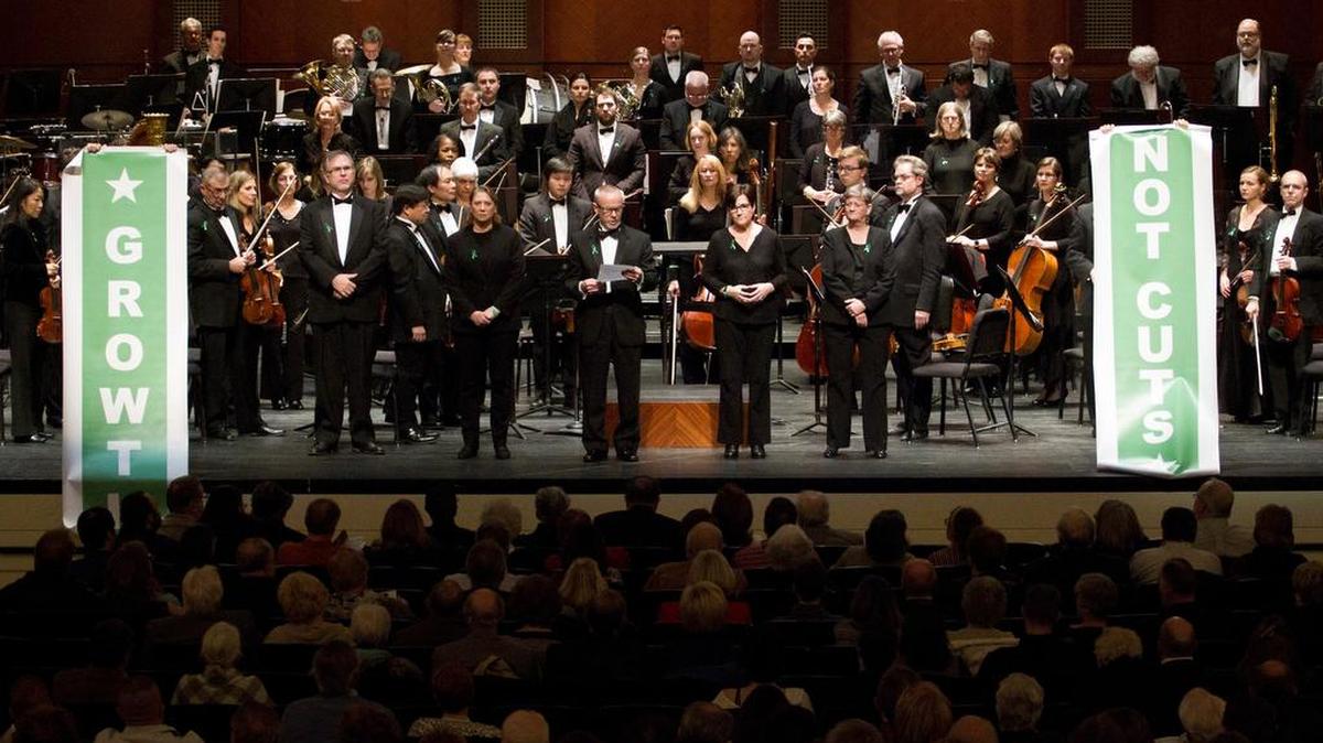Musicians from the Fort Worth Symphony Orchestra talk about their contract negotiations before a performance.