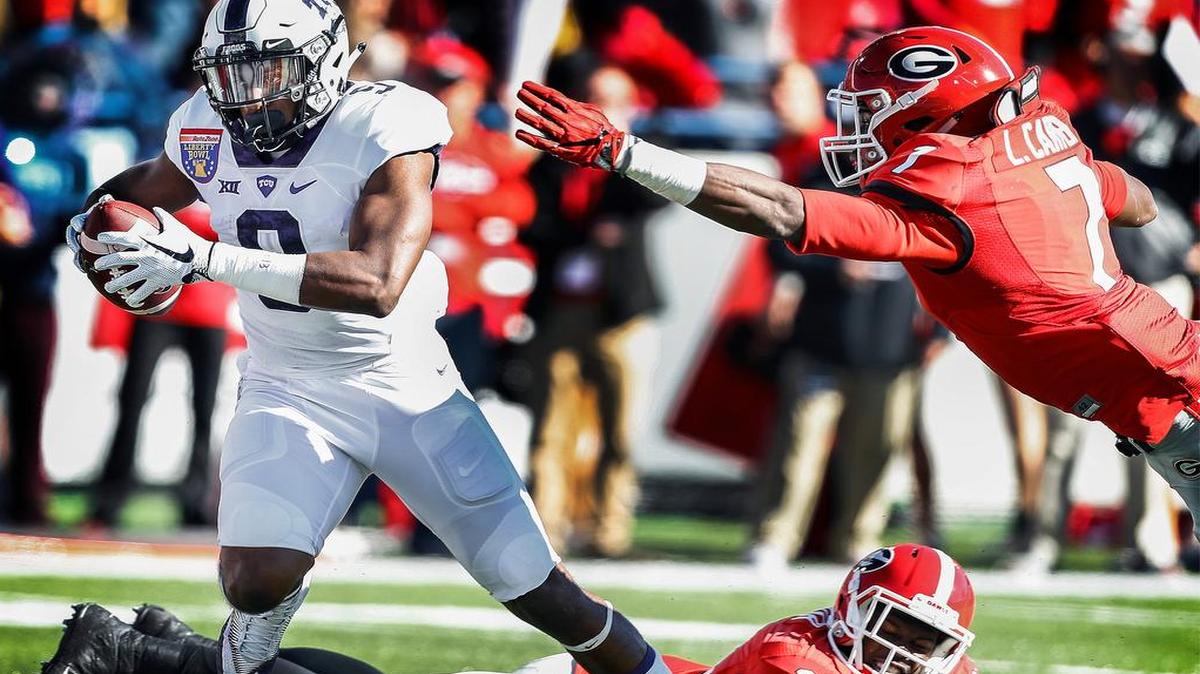 TCU receiver John Diarse, left, scrambles for a touchdown Dec. 30 at the Liberty Bowl.