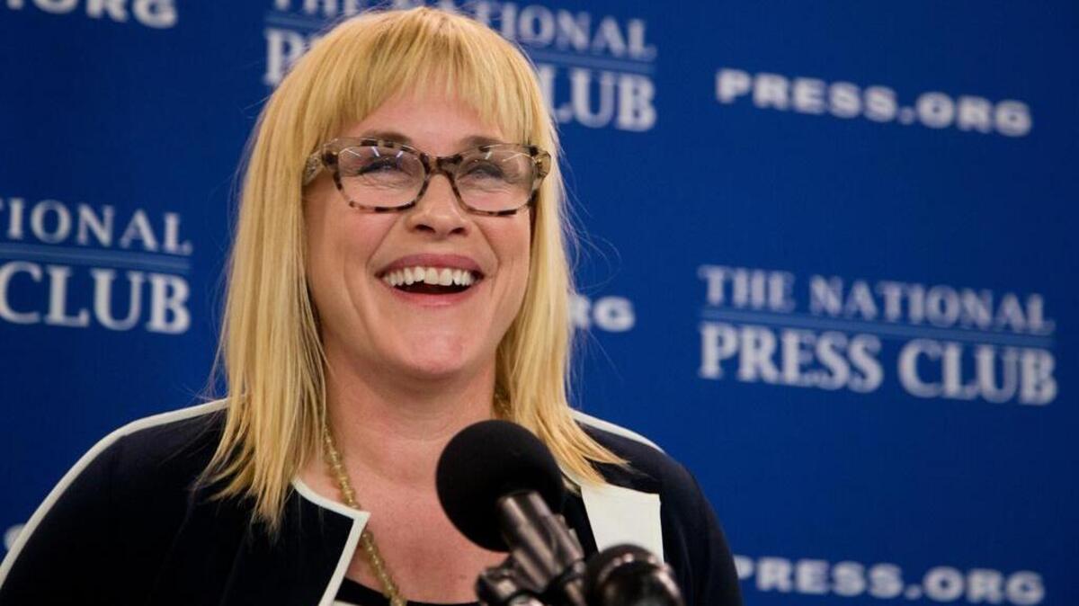 Actress and pay equity advocate Patricia Arquette laughs during a National Press Club Newsmaker news conference on Equal Pay Day, Tuesday, April 12, 2016, at the National Press Club in Washington.