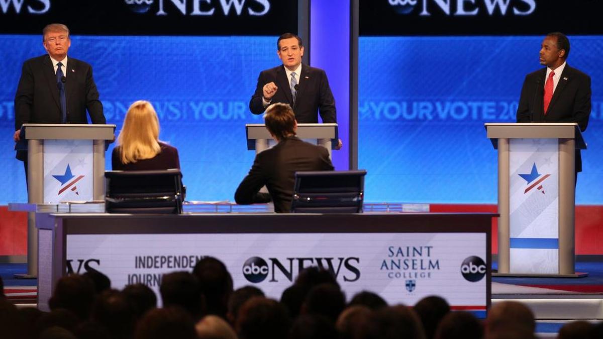 Ted Cruz speaks, as Donald Trump, left, and Ben Carson, right, look on, during the Republican presidential debate hosted by ABC News at Saint Anselm College in Manchester, N.H., Feb. 6, 2016.