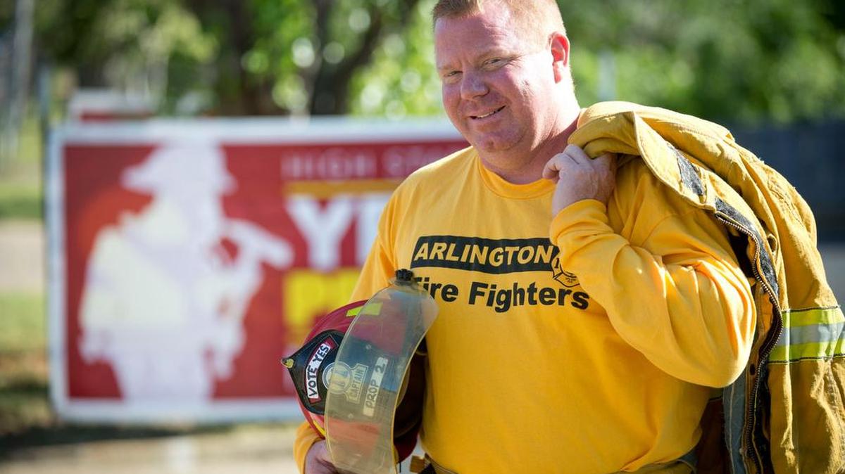 Arlington Firefighter Shawn Graham, a member of the Arlington Professional Fire Fighters Association, is campaigning for voters in the May 6 election to approve civil service for the fire department.