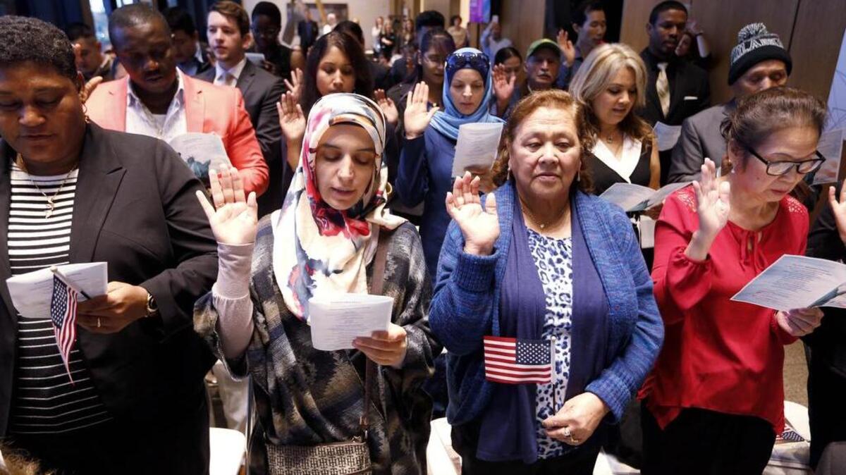 About 40 immigrants participate in a naturalization ceremony to become U.S. citizens at the Amon Carter Museum of American Art in Fort Worth, Texas on November 21, 2016.