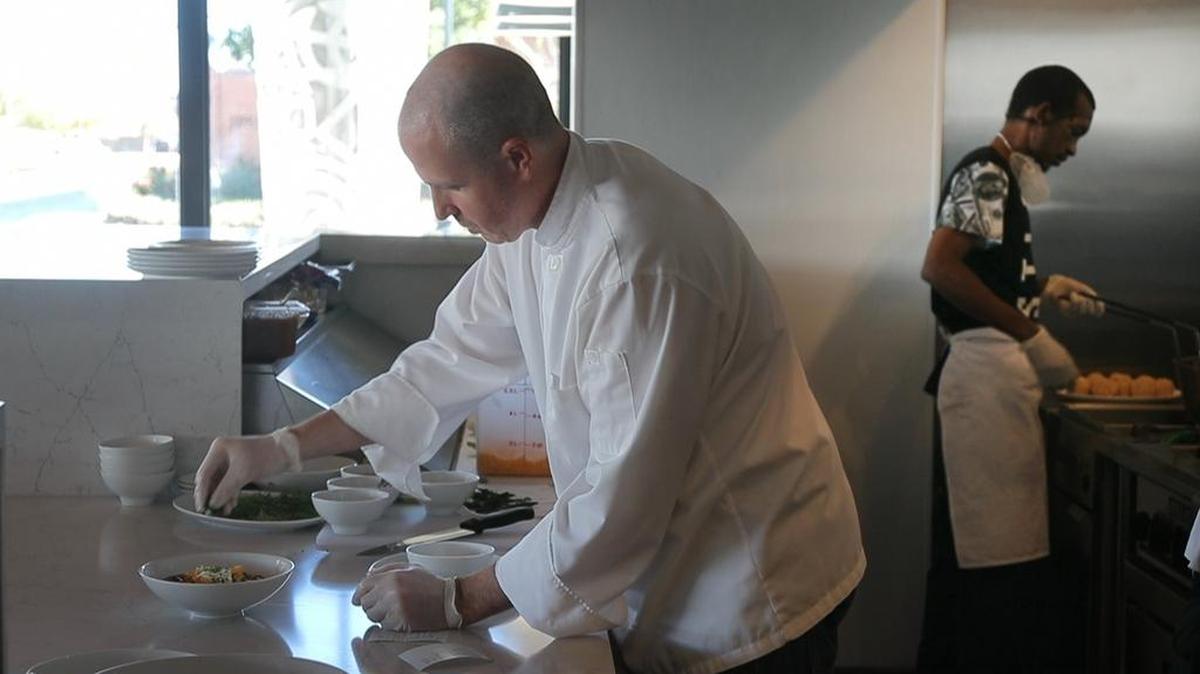 Chef Jeff Williams prepares a dish at the Taste Project Community Restaurant.