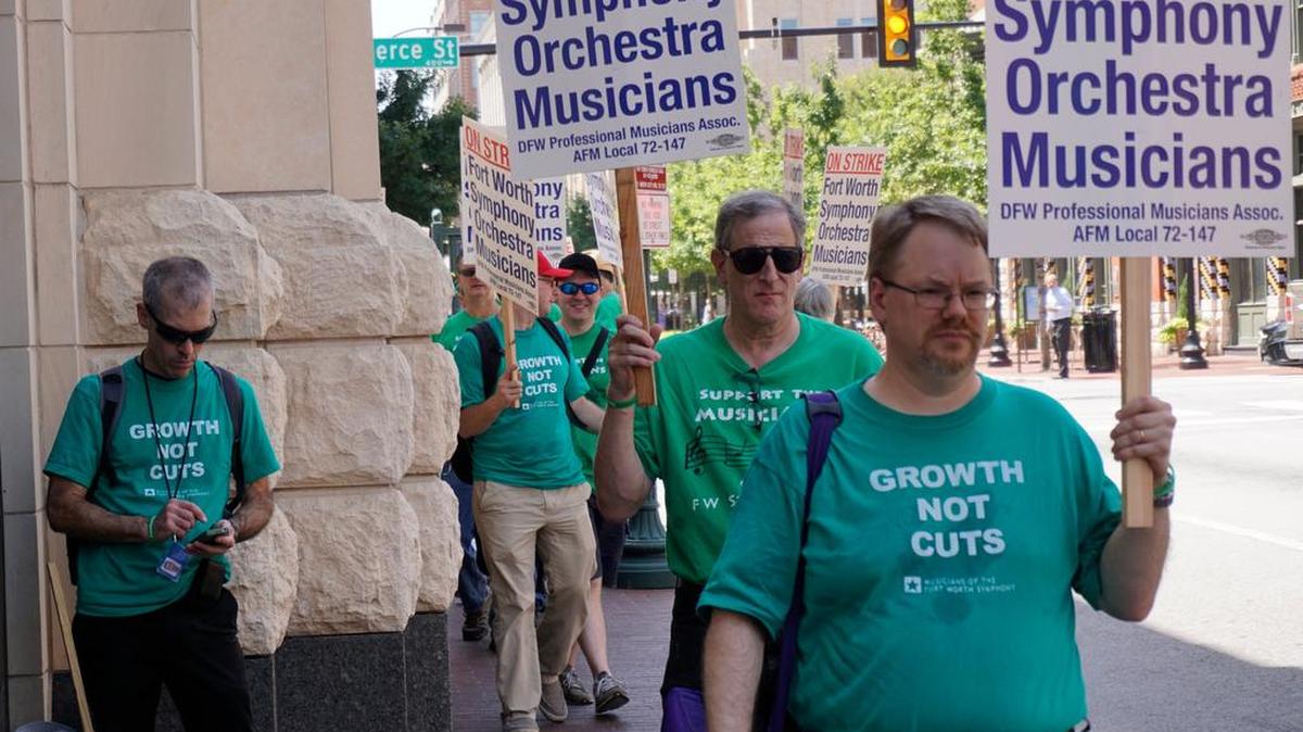 Fort Worth Symphony musicians walk the picket line in front of Bass Hall after calling a strike Thursday.