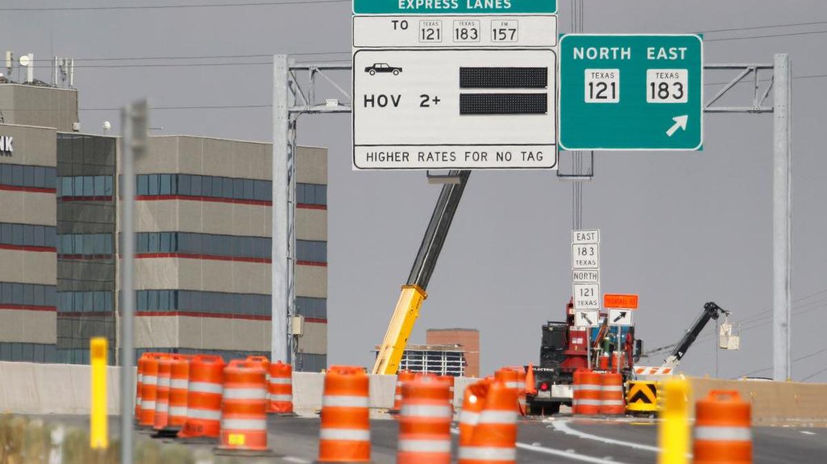 Toll signs next to free lane choices. After four years of construction, the $2.5 billion makeover of North Tarrant Express through the mid-cities is finally done.