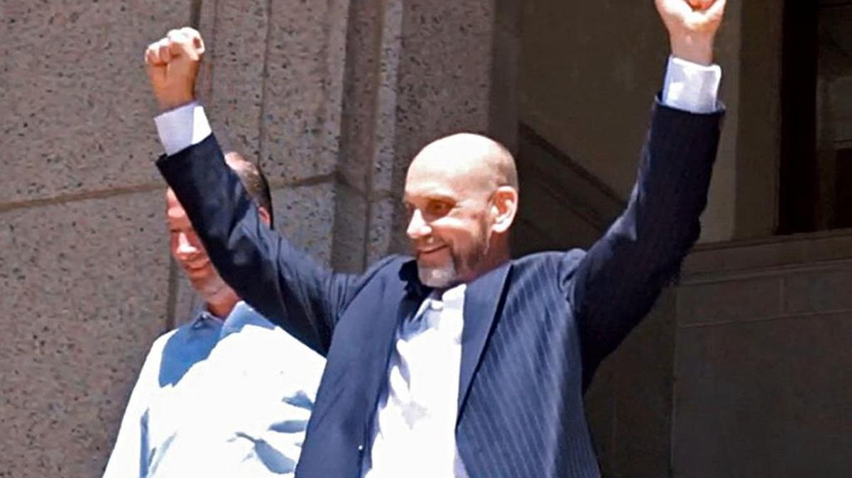 Brian Edward Franklin, released from prison after his conviction for rape was overturned by an appeals court, leaves the Tarrant County Corrections office at 200 W. Belknap, with his arms raised in celebration.
