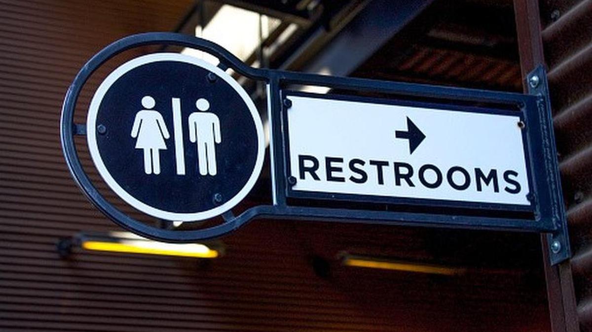 Outdoor Metallic Restroom Sign Close Up