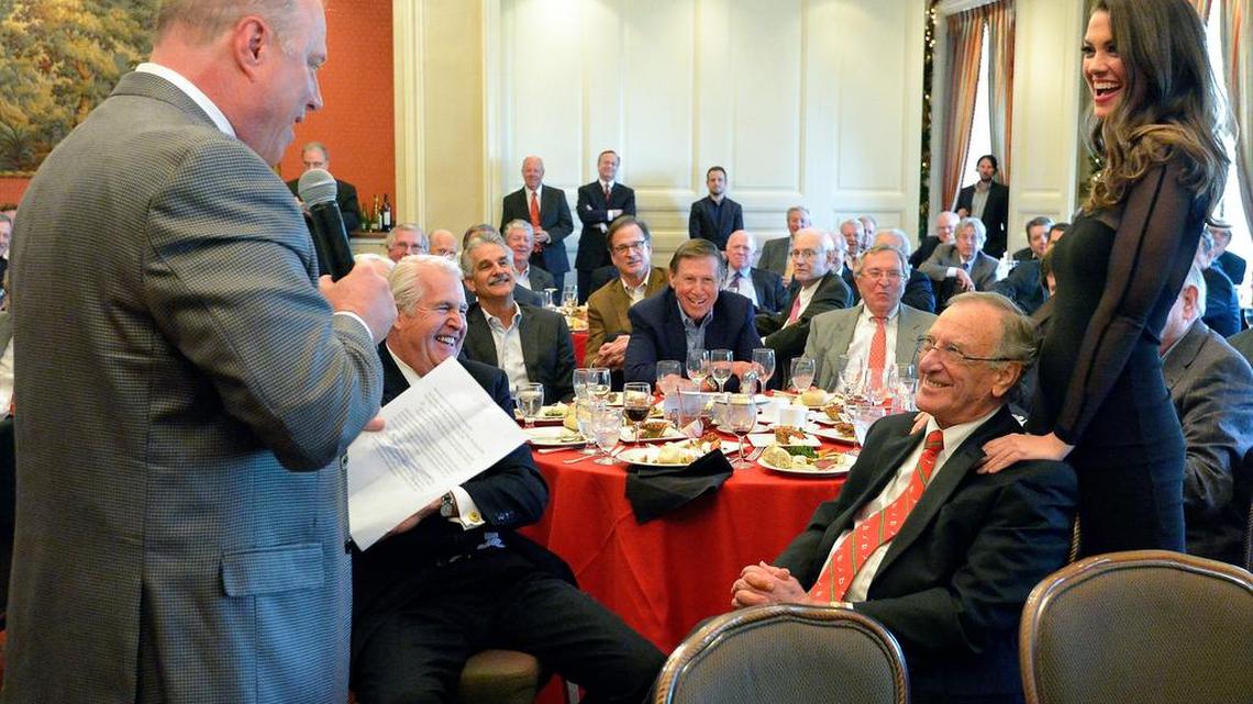“Chief Extractor” George Young, left, and Maggie Parks, right, collect Goodfellows gifts at the Exchange Club Dec. 9.