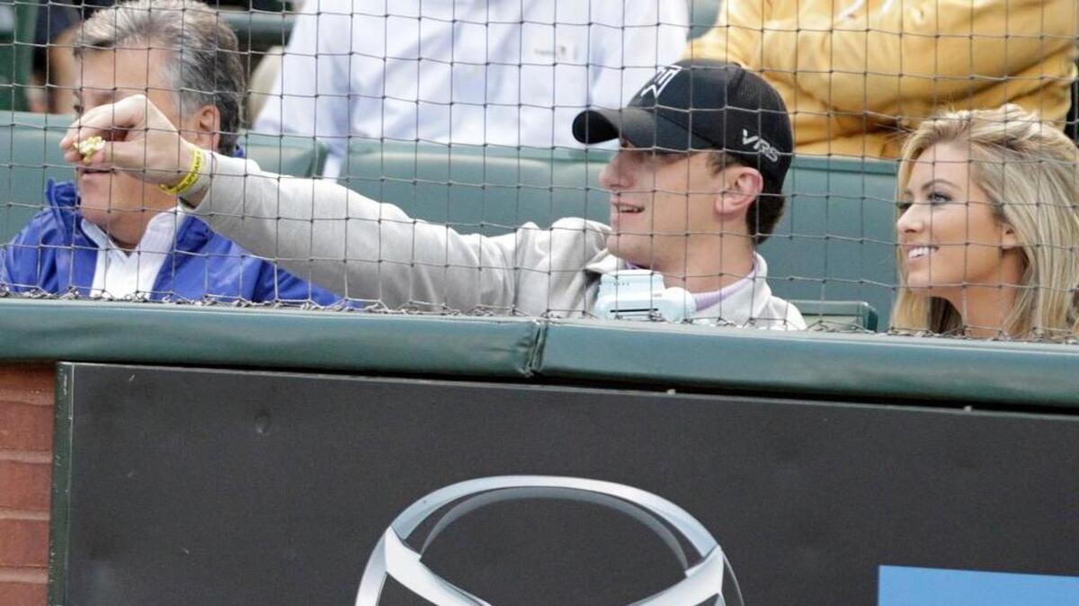 Former Texas A&M and Cleveland Browns quarterback Johnny Manziel watches a Texas Rangers game last year.