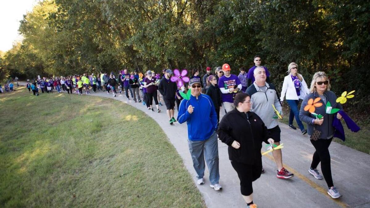 Participants take to the trails during a Walk to End Alzheimers event Oct. 8 at Church at the Cross in Grapevine.