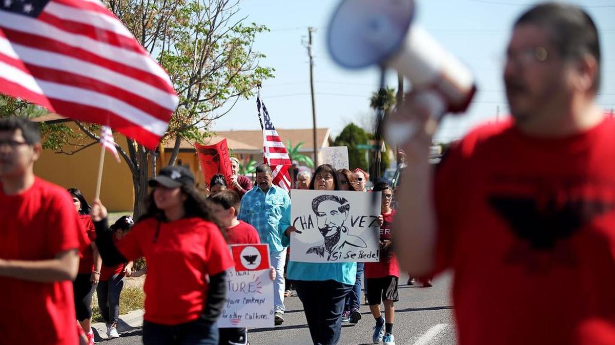 Demonstrators march in Odessa in 2016 to honor civil rights activist and farm labor leader César Chávez. Mexican-American experts want the State Board of Education to rename a recently approved high school course.