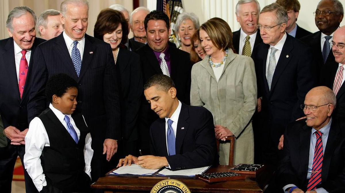 In this March 23, 2010, file photo, President Barack Obama signs the health care bill in the East Room of the White House in Washington.