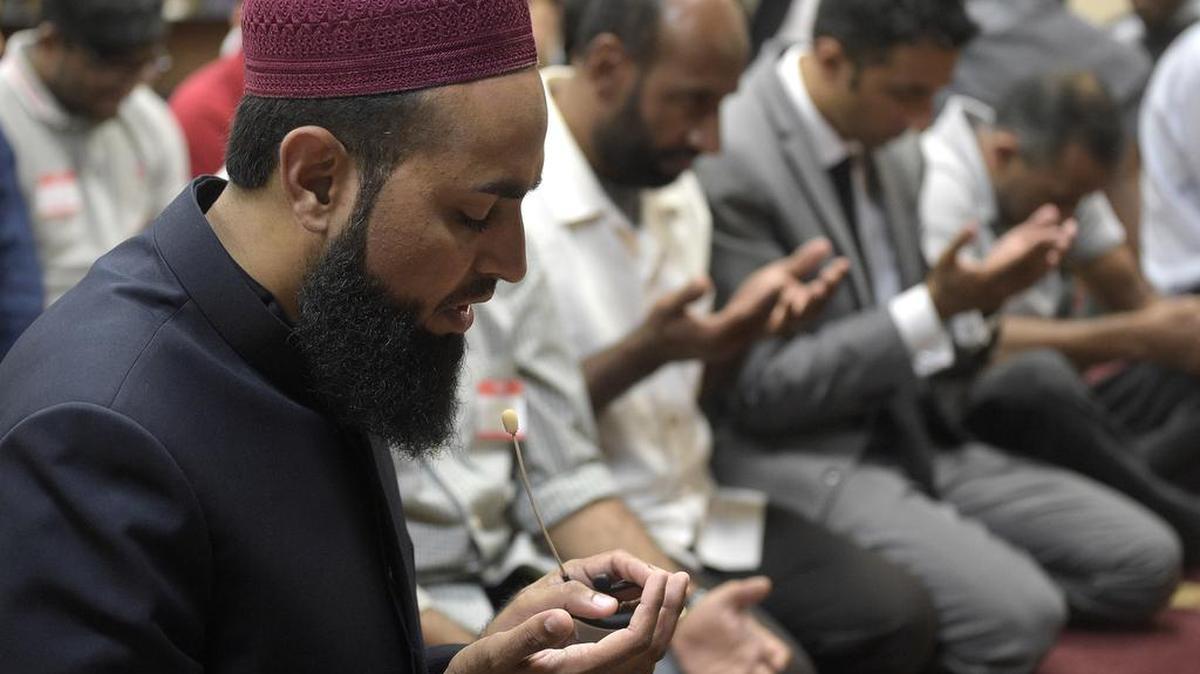 Imam Azhar Subedar speaks Monday during a prayer at the American Muslim Community Center in Longwood, Fla.