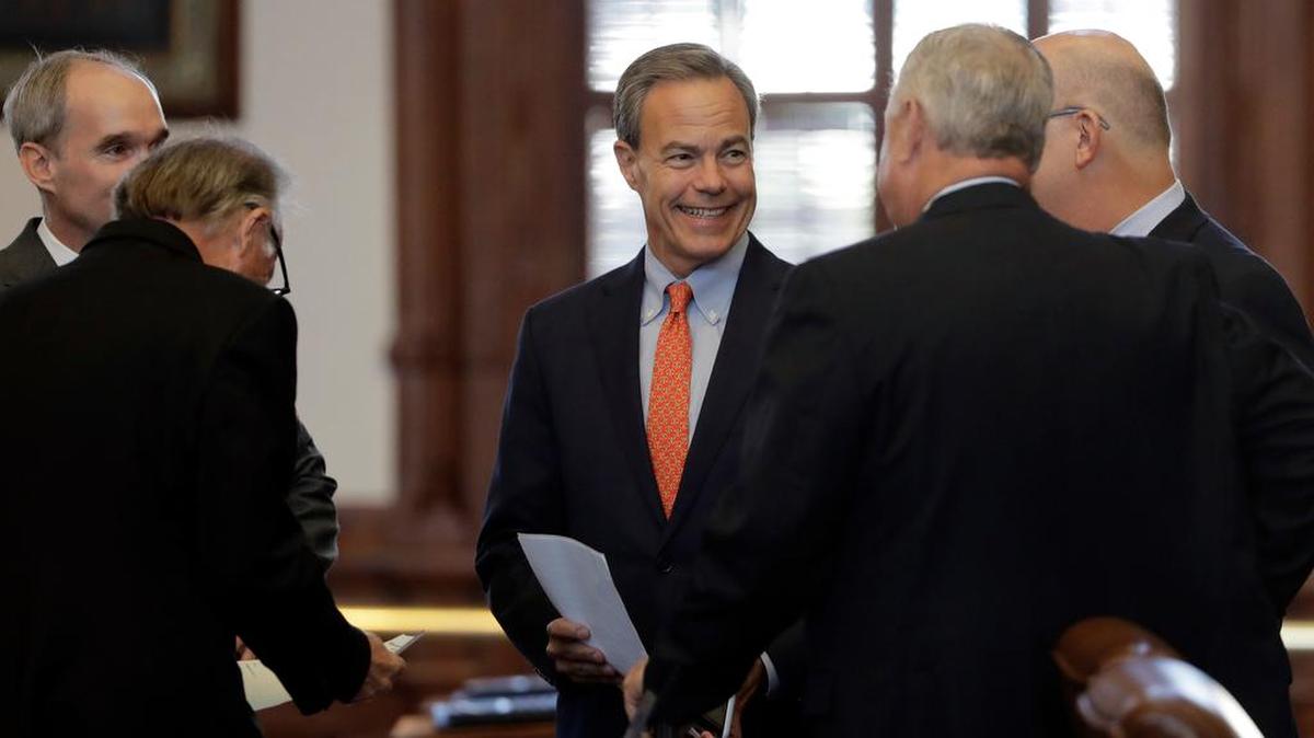 Texas Speaker of the House Joe Straus, R-San Antonio, center, visits with fellow lawmakers on the House floor in Austin, Texas, Tuesday, July 18, 2017.