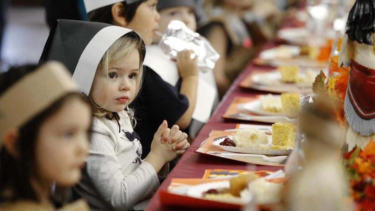 Ansel Lange, 4, prays before her pre-school’s Thanksgiving fest last year at Trinity Episcopal Church in Fort Worth.