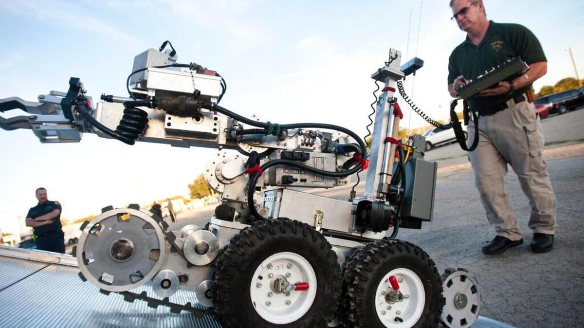 Charles Mitchell, of the North East Explosive Response team, drives a police robot during a demonstration in 2014.