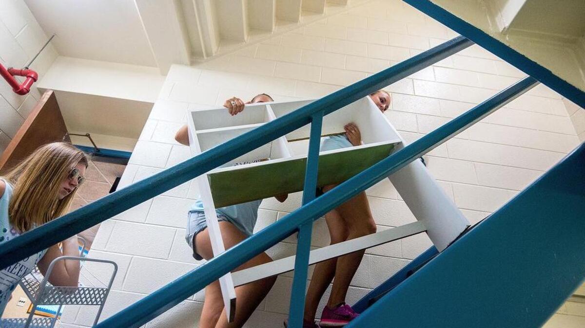 Volunteers from sorority Zeta Tau Alpha help James Madison University freshmen move in to their dorm rooms at Eagle Hall Tuesday, Aug. 22, 2017, the week before school starts in Harrisonburg, Va.