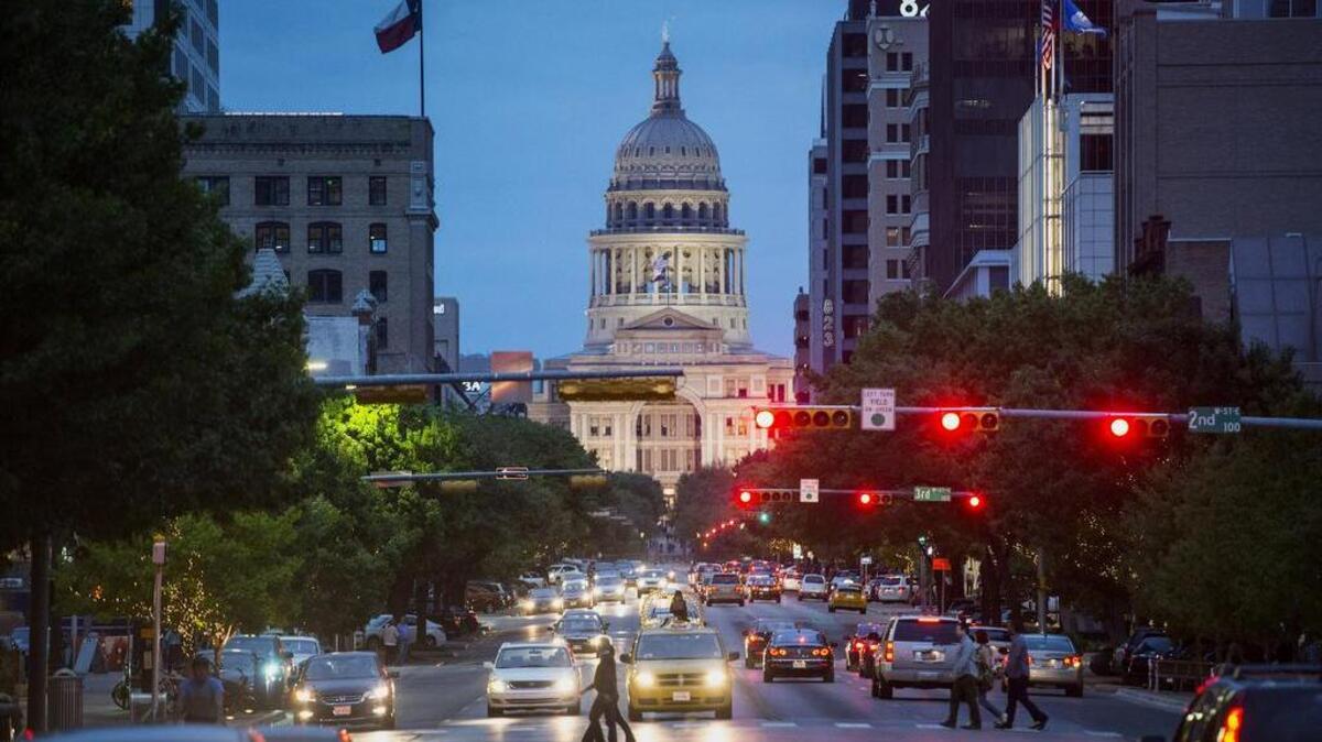 The Texas State Capitol building at dusk in Austin.