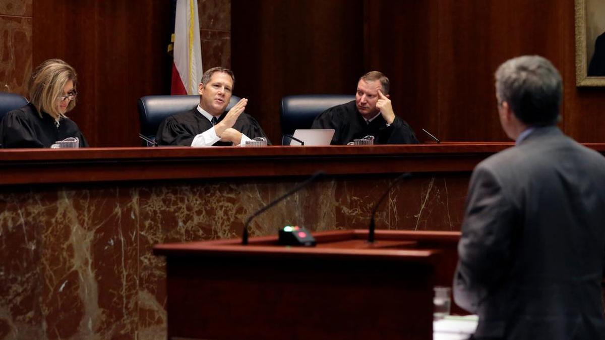 
Texas Supreme Court Justice Jeffery Boyd, second from left, asks questions Sept. 1 during oral arguments in the latest school finance case. 
