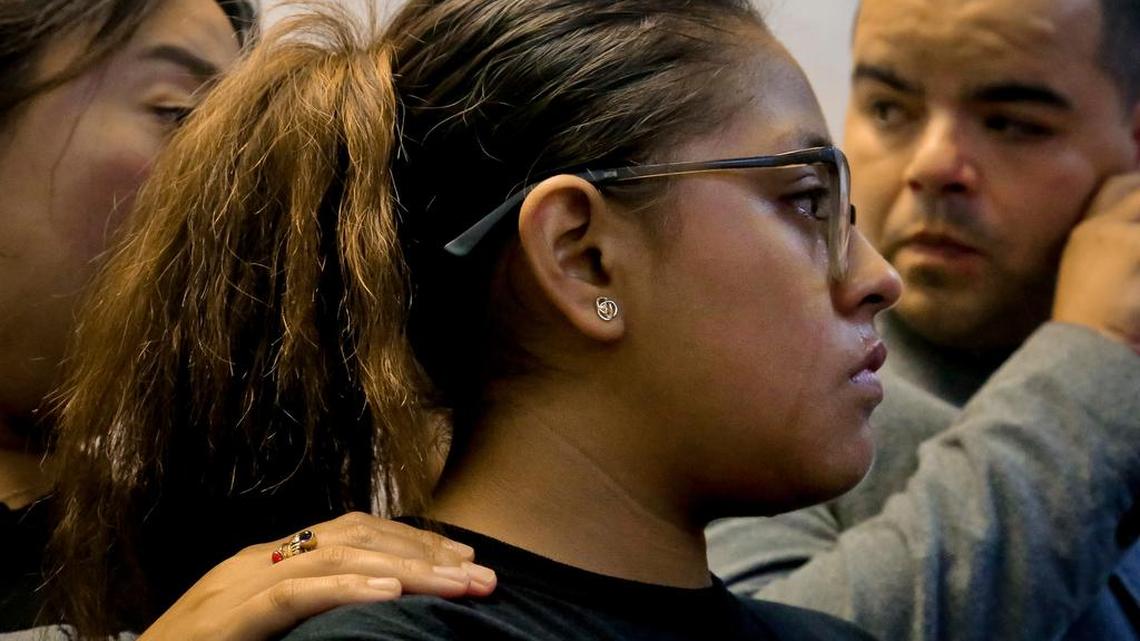 Flor Reyes, 20, center, a student at Lehman College who came from Mexico to the U.S. when she was 2 years old, is comforted as she holds back tears after making emotional remarks, during New York Immigration Coalition press conference on the ending of the government's Deferred Action for Childhood Arrivals (DACA) program, Tuesday Sept. 5, 2017, in New York. "I feel a great sense of disappointment," said Reyes a DACA recipient. "We have come out of the shadows only to be in more danger." President Donald Trump on Tuesday began dismantling the DACA, a government program protecting hundreds of thousands of young immigrants who were brought into the country illegally as children.