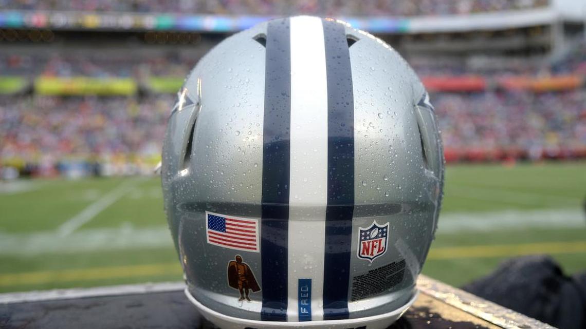A Dallas Cowboys helmet sits on a locker behind the bench during the NFL Pro Bowl football game last month.