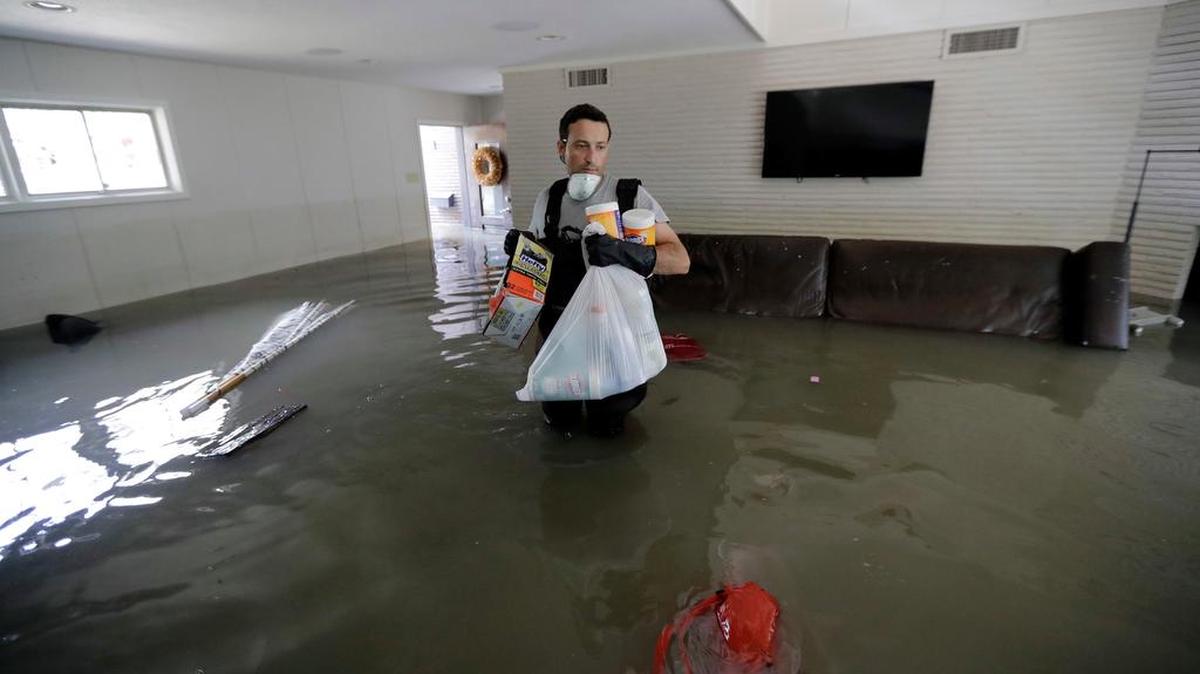 Gaston Kirby walks through floodwater inside his home in the aftermath of Hurricane Harvey in Houston earlier this month.