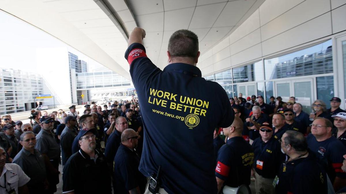 A strategic action coordinator for the Transport Workers Union, addresses a crowd at DFW Airport, last Wednesday.