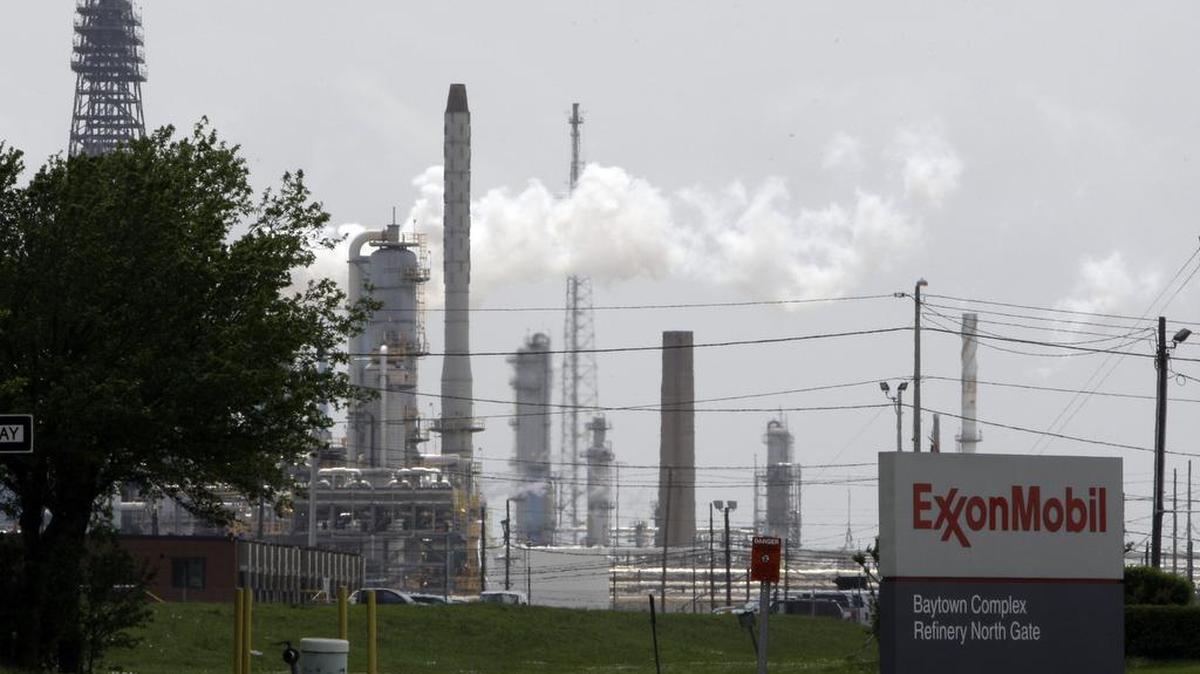 Steam rises from towers at an ExxonMobil refinery in Baytown. A judge has ordered the Irving-based company to pay nearly $20 million for releasing 10 million pounds of pollutants into the air over the course of eight years from the refinery.