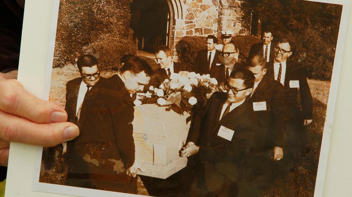 In 2013, former Associated Press and Star-Telegram reporter Mike Cochran holds a picture taken when he and other reporters were drafted to be the pall bearers for Lee Harvey Oswald because no one else was available at Rose Hill Cemetery (now Shannon Rose Hill) where accused Kennedy assassin Lee Harvey Oswald was buried after he was shot by Jack Ruby.