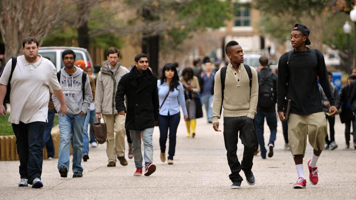 Students between classes at The University of Texas at Arlington. Texas has set high goals from getting more students in college and graduating them.