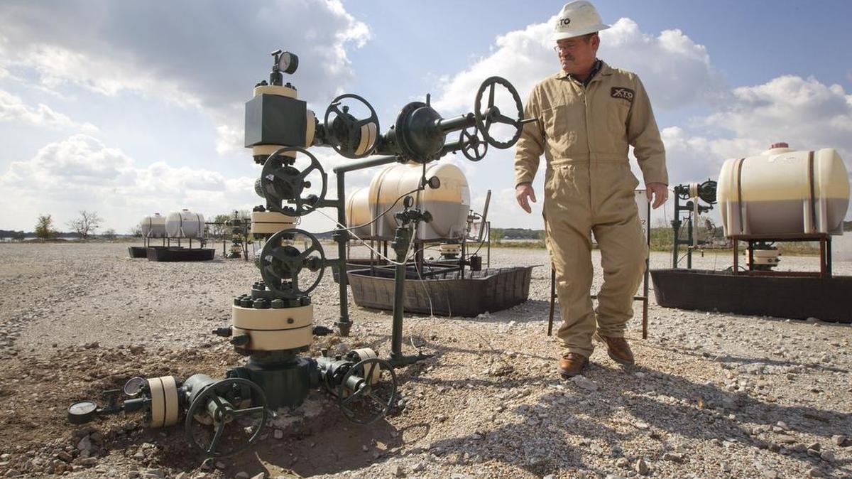 
An employee of Fort Worth’s XTO Energy checks a wellhead at a Barnett Shale natural gas production site. 
