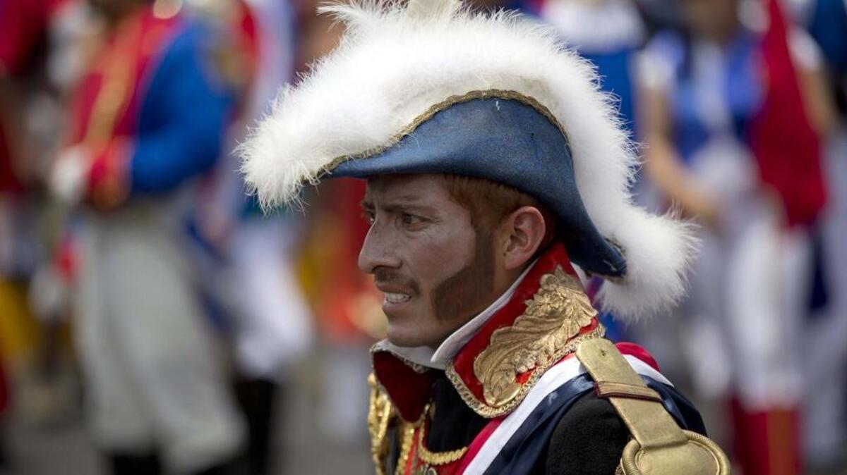 A man plays a French army officer during a re-enactment of the Battle of Puebla at a Cinco de Mayo celebration in Mexico City.