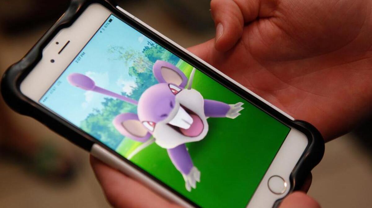Carter Keyworth, 15, of Fort Worth plays the Pokemon Go game.