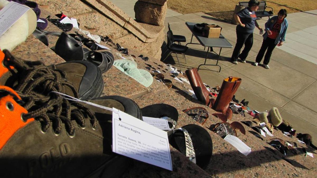 Zonta members helped set up an exhibit of 114 pairs of shoes on the Tarrant County Courthouse steps, each pair representing a Texas woman who died in a domestic violence incident in 2012.