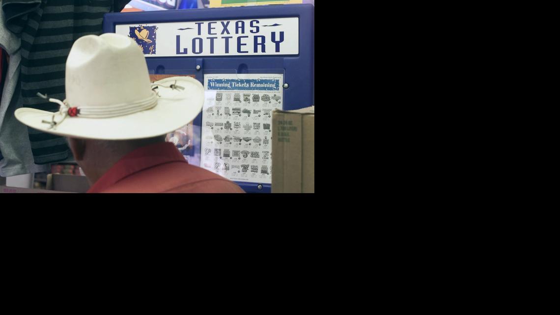 
Texas Lottery player marks his numbers at a convenience store in Austin. 
