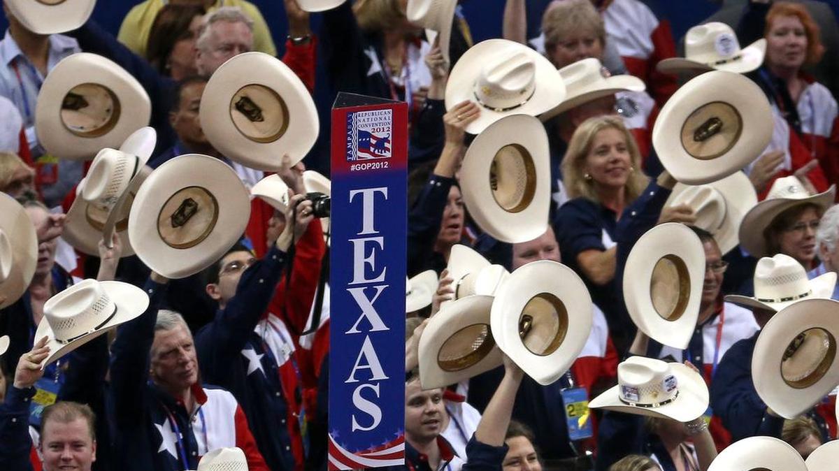 Texas delegates tip their hats during the 2012 Republican National Convention in Tampa, Fla.