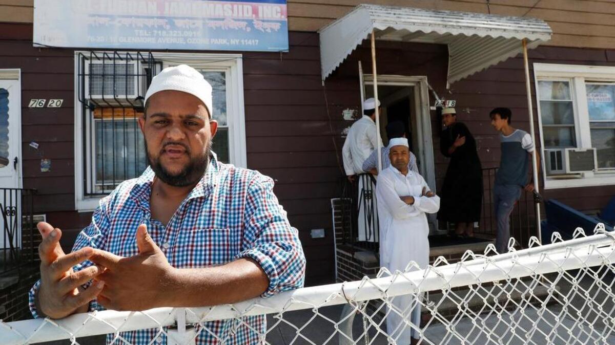 Nurul Hoque gestures Aug. 17 during an interview with The Associated Press outside the Al-Furqan Jame mosque in New York. The shooting of an imam and his assistant near their New York mosque unnerved Muslims.