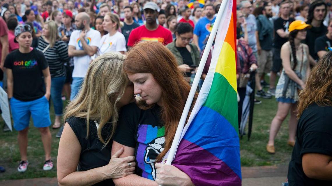 Randa Black hugs McKenna Post during a Pulse nightclub shooting vigil in Orlando, Fla. last month.