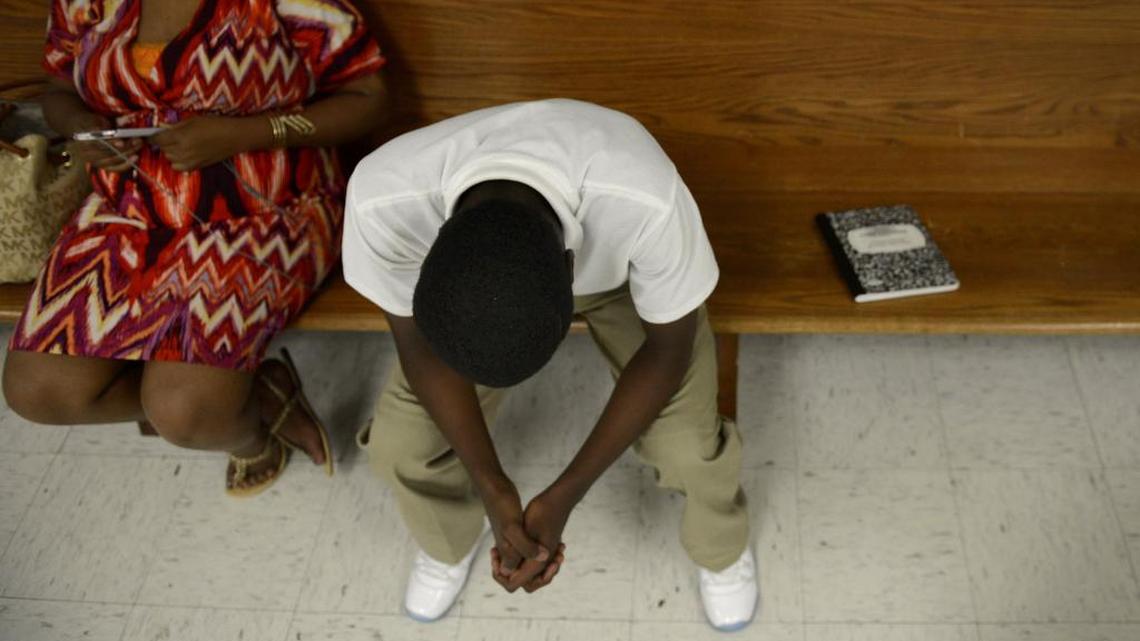 A boy from a diversion court waits to speak at the Henry Wade Juvenile Justice Center on March 16, 2015, in Dallas.