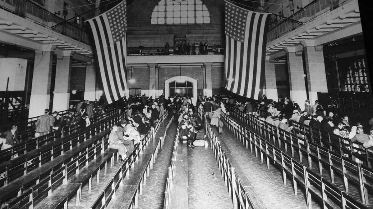 The registry room at Ellis Island in New York harbor in 1924. Immigration to the U.S has come in swells and dips over the past two-plus centuries, driven by shifts in U.S. policy, the mood in the country and world events. Labor shortages, racial tension, economic forces, religious prejudice and national security concerns all fit into the picture.